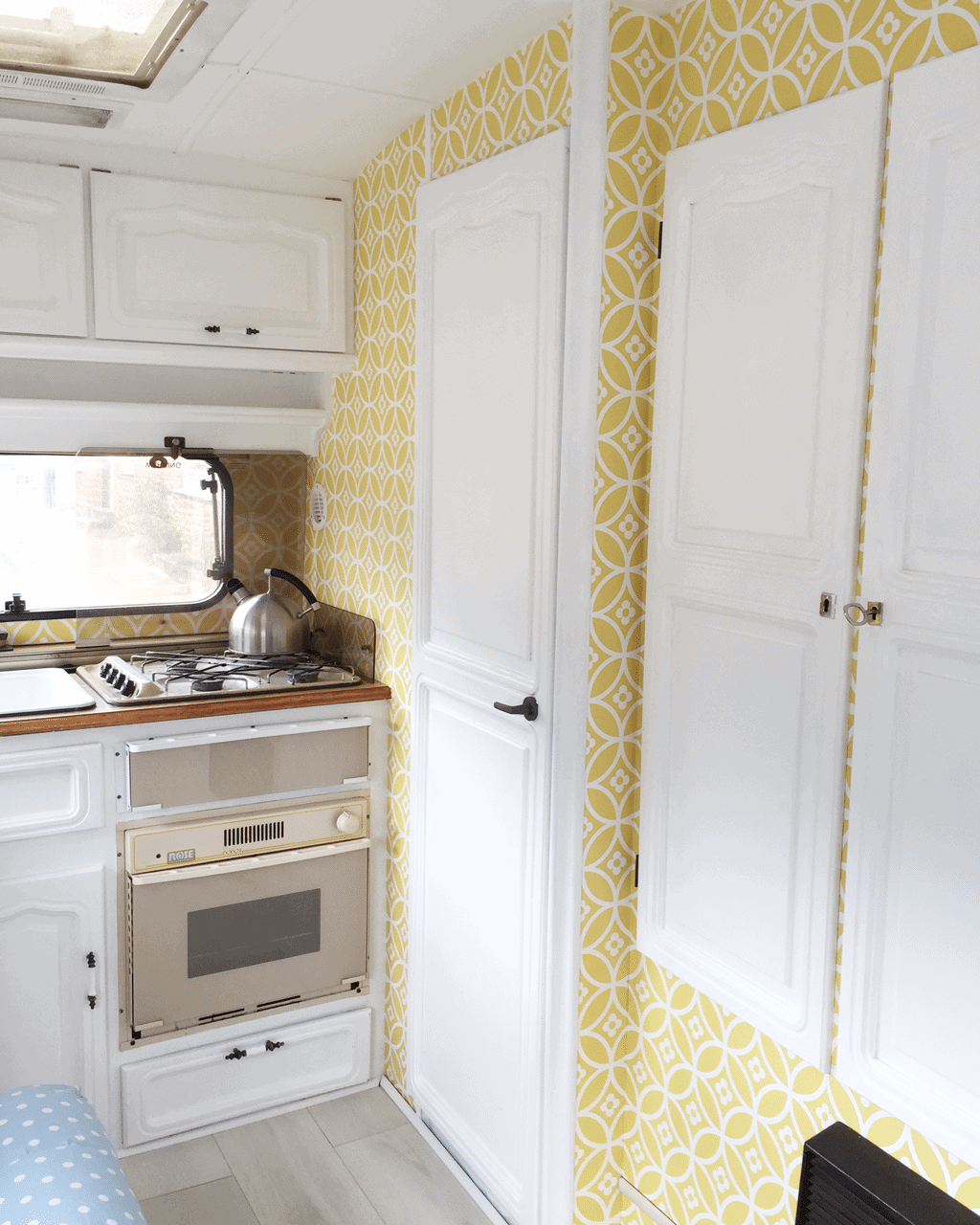 Yellow colour scheme for a small caravan interior.