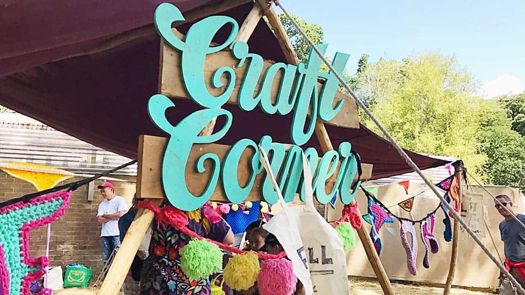 The Craft Corner at Camp Bestival 2018 where we learnt how to make pom poms