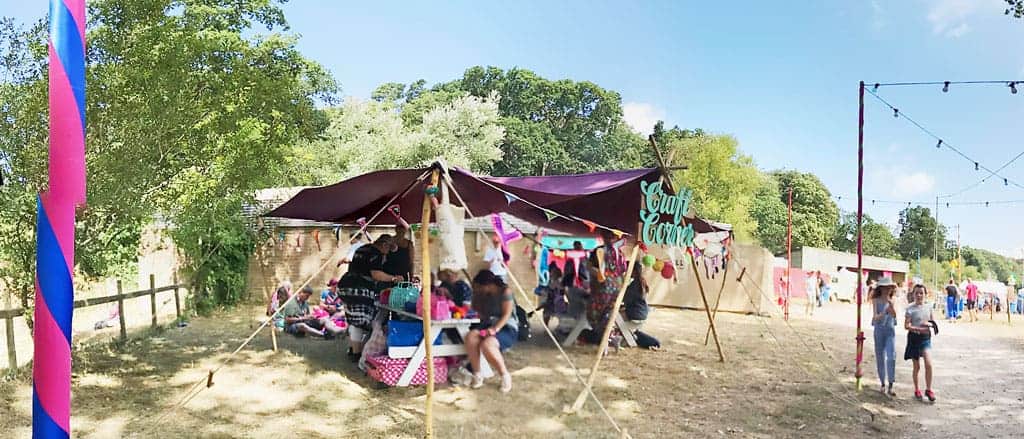 The Craft Corner at Camp Bestival 2018 where we learnt how to make pom poms