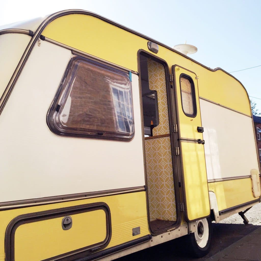 Our little yellow and white caravan! Dolly the caravan after her makeover.