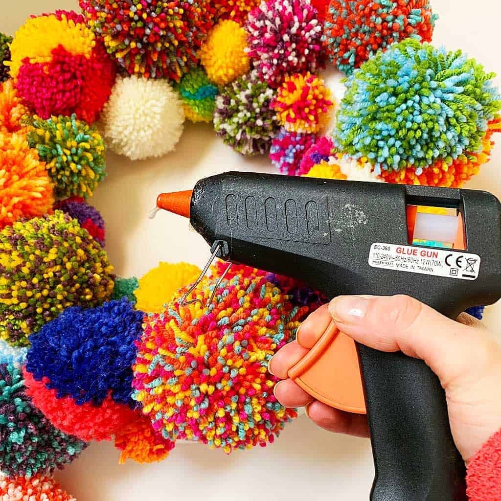 Make a Pom Pom Wreath like the Anthropologie one? This is such a fun project!